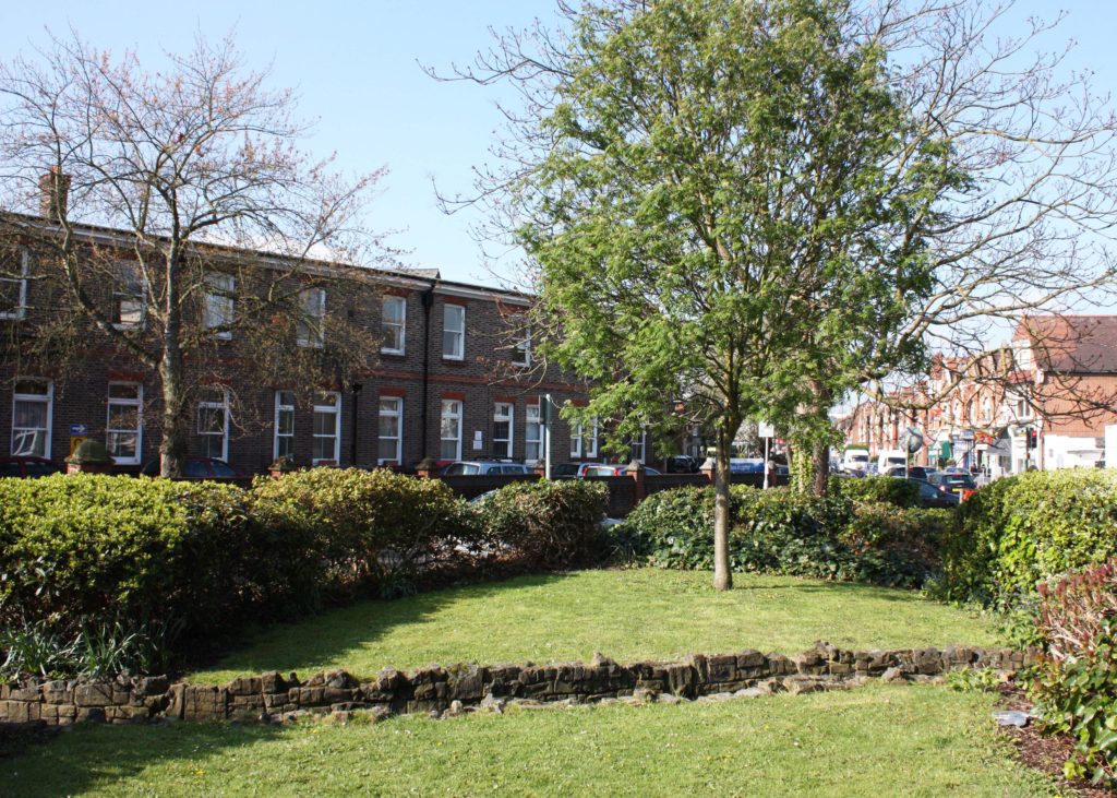 The Rush, Kingston Road, Merton Park, SW19. The Rush Island, looking west towards the Nelson Hospital. The 1942 Hospital extension is on the left.