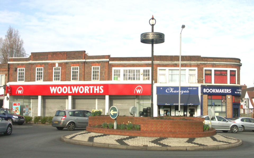 London Road / Morden Road Roundabout, Morden, Surrey SM4. Woolworths with new-style fascia (closed later in year with end of company)