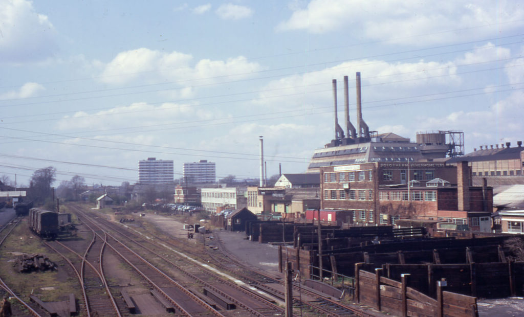 Railway and Board Mills, Merton, London SW 19. From Christchurch Bridge. The site of Merton Abbey. The railway route is now (2009) Merantun Way. and site of Board Mills is now Sainsbury