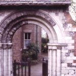 Norman Arch from Merton Priory in churchyard of St Mary