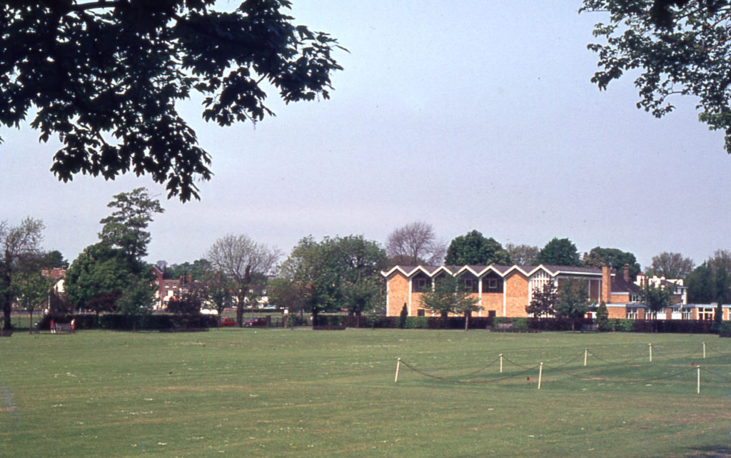 The Canons front lawn, The Canons, Madeira Road, Mitcham, Surrey CR4. Gifted c. 1150 by the parishioners of Mitcham to the Augustian canons at Southwark Priory. Mitcham Methodist Church beyond.