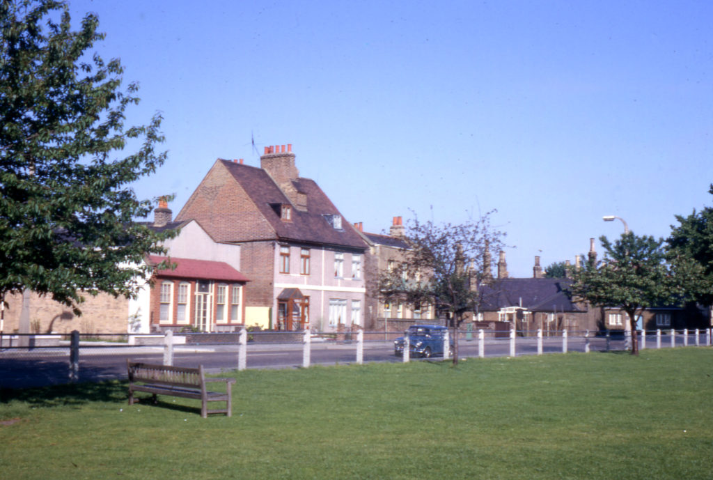 Houses along Cricket Green, Mitcham, Surrey CR4. No. 46 Cricket Green on left. Looking west.