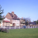 Houses along Cricket Green, Mitcham, Surrey CR4. No. 46 Cricket Green on left. Looking west.