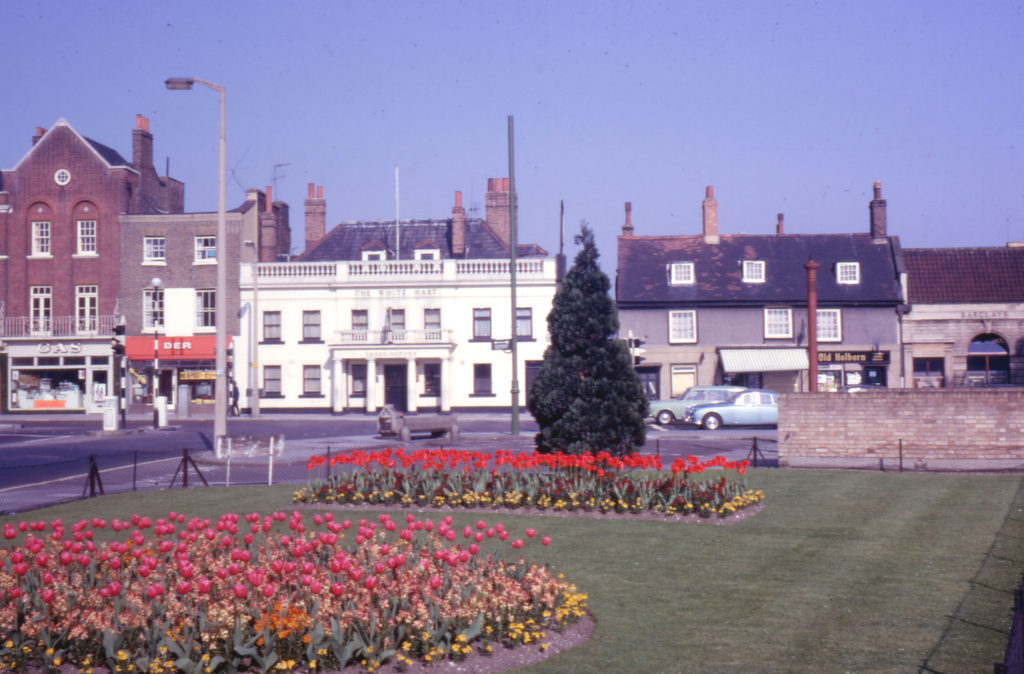 The White Hart, 350 London Road, Mitcham, Surrey CR4. Looking west. with tulips at the Cricket Green.