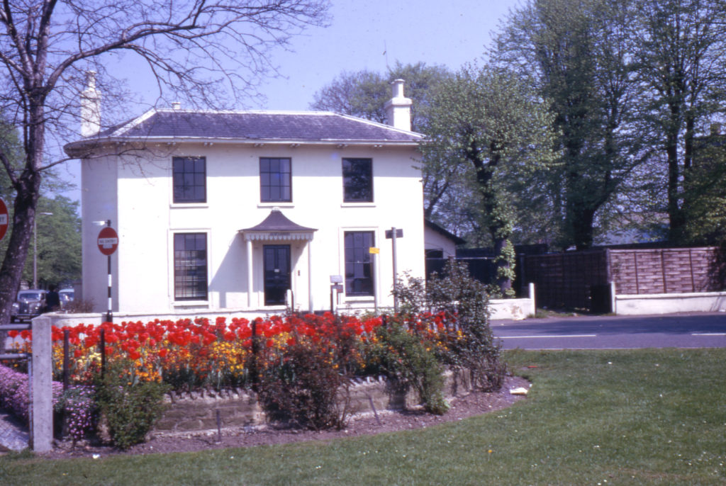Elm Lodge, Cricket Green, Mitcham, Surrey CR4. On corner of London Road. Built c. 1808. In 1966 it was used as a GP's practice.
