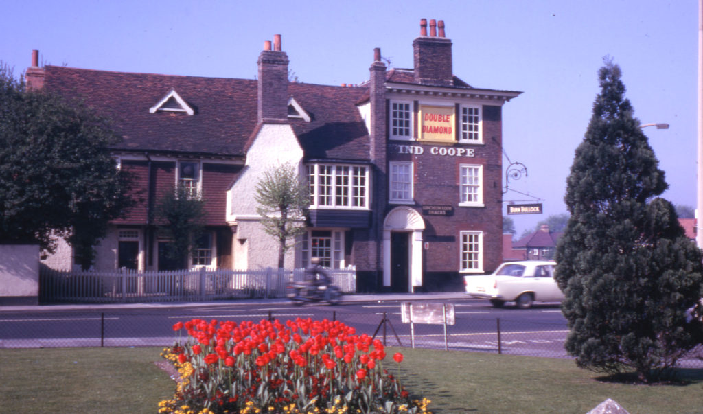 The Kings Head, 315 London Road, (at Mitcham Cricket Green), Mitcham, Surrey CR4. Looking south-west from edge of Cricket Green. Rear (on left) dates from late 16th or early 17th century. The front (right) os 1760. In 1975 re-named Burn Bullock.