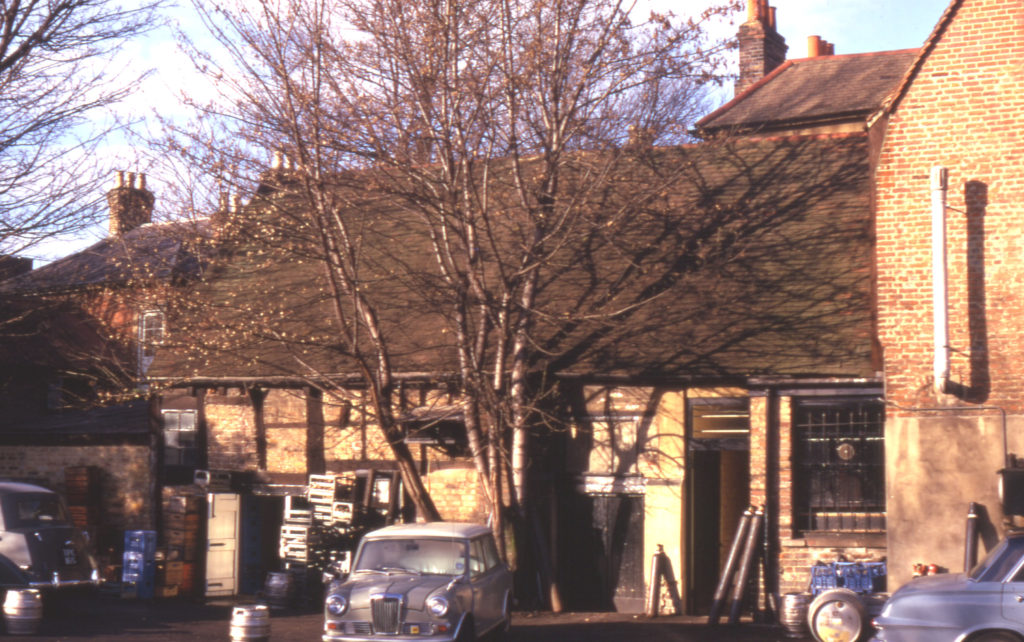 Rear of the Kings Head, 315 London Road, Mitcham Cricket Green, Mitcham, Surrey CR4. Timber-framed brick-nogged outbuilding. Rear of inn dates from late 16th or early 17th century.