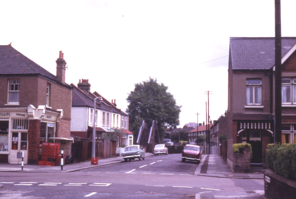 Robinson Road, Colliers Wood, London SW19. Footbridge (1867) over railway to Swains Road. Railway from Merton Abbey to Tooting Junction now gone.