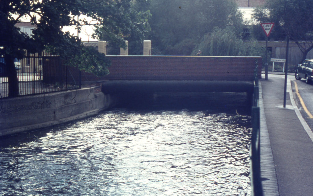 Merton Bridge and River Wandle, Colliers Wood, London SW19. Looking south from Wandle Bank.
