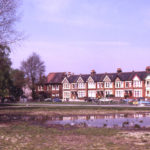 Figges Marsh with Gorringe Park Avenue in background, Mitcham, Surrey CR4. Pond forming on site of old air-raid shelter and earlier pond. Little Graveney ran along eastern (right-hand) side of Marsh