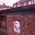 Merchant Taylors' Stone (1652), Roe Bridge, London SW16. In north parapet wall. Inscription says This bridge was made at the cost of the Worshipful Company of Merchant Taylors. Bridge re-built and stone reset several times since.