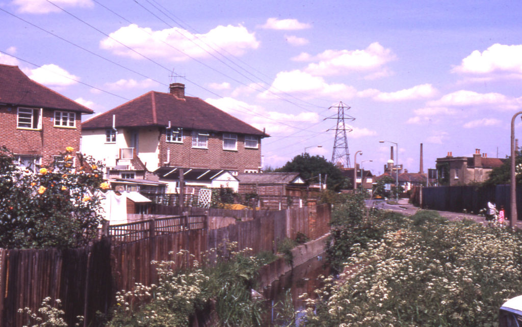 Phipps Bridge Road and Merton/Mitcham boundary ditch, Mitcham, Surrey CR4. Looking north east.