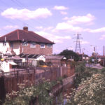 Phipps Bridge Road and Merton/Mitcham boundary ditch, Mitcham, Surrey CR4. Looking north east.