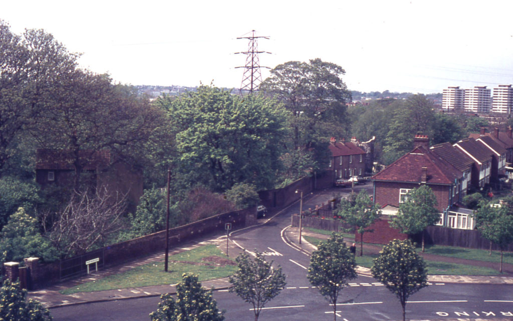 Grounds of Wandle Villa and Phipps Bridge Road from Council flats, Mitcham, Surrey CR4.