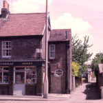 The Wheatsheaf (off-licence) and Fox's Path, Church Road, Mitcham, Surrey CR4. Wheatsheaf (Eric Ives). By 1979 the Wheatsheaf was isolated. having survived the demolition of adjoining houses.