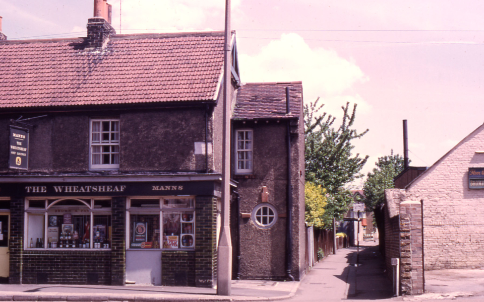The Wheatsheaf (off-licence) and Fox's Path, Church Road, Mitcham, Surrey CR4. Wheatsheaf (Eric Ives). By 1979 the Wheatsheaf was isolated. having survived the demolition of adjoining houses.