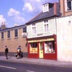 55 Upper Green East, Mitcham, Surrey CR4. Built early 19 th century. the home of John Robert Chart and wife Mary. Acquired by Alfred Crisp. 1932. boot & shoe repairers. Converted to a private house 1991.